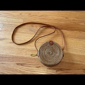 The winding road mini crossbody handwoven basket bag